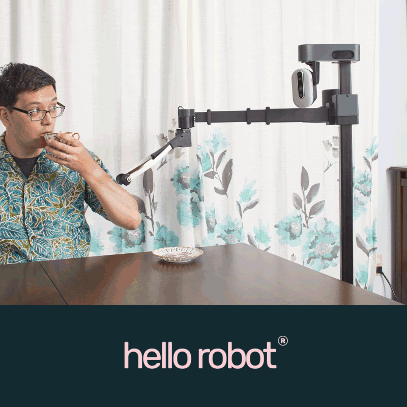An animation of the Stretch robot taking a teacup from yours truly, with the Hello Robot logo beneath.